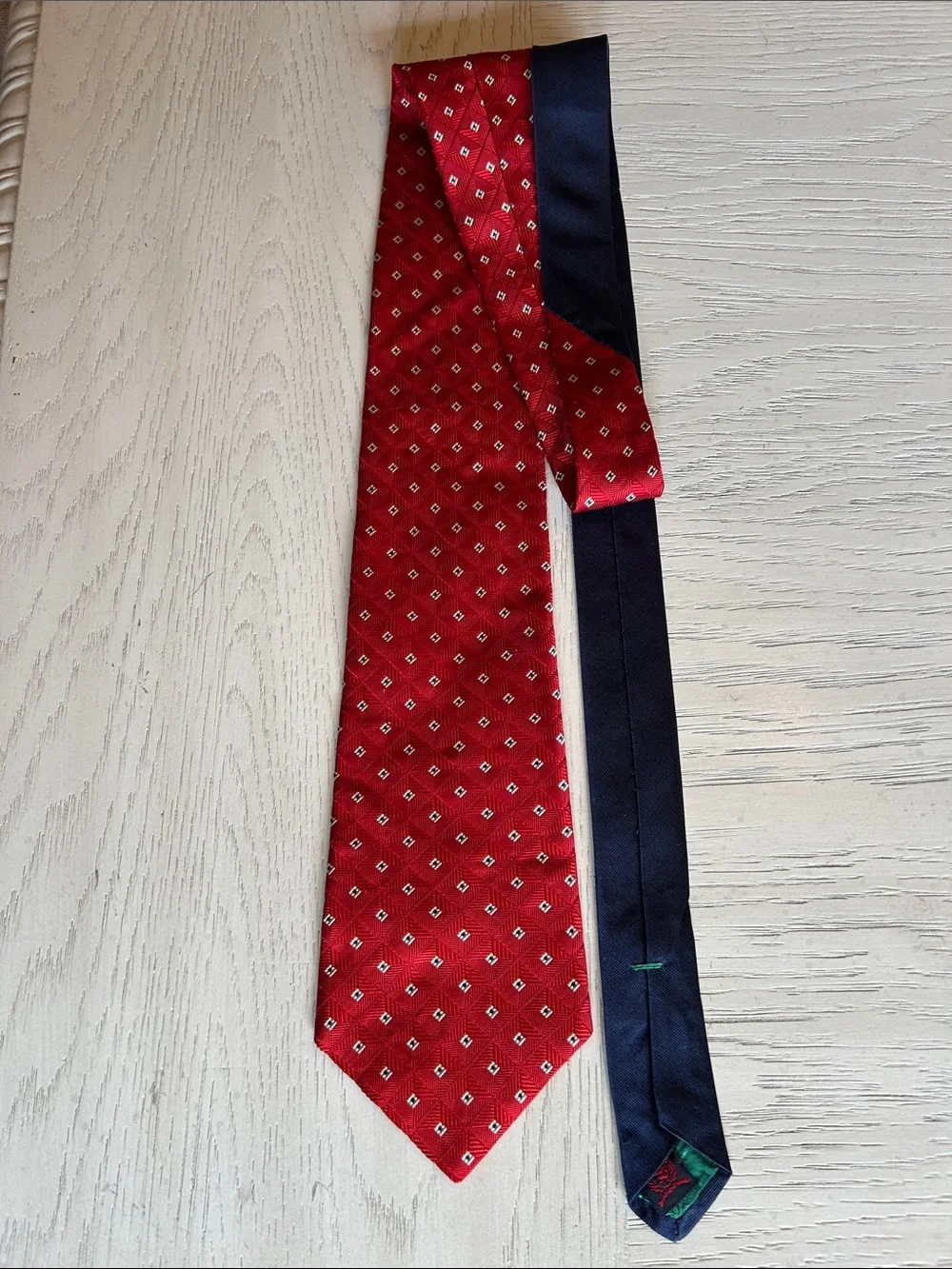 Tommy Hilfiger 100% Silk Red Diamond Pattern Silk Tie with Navy Backing